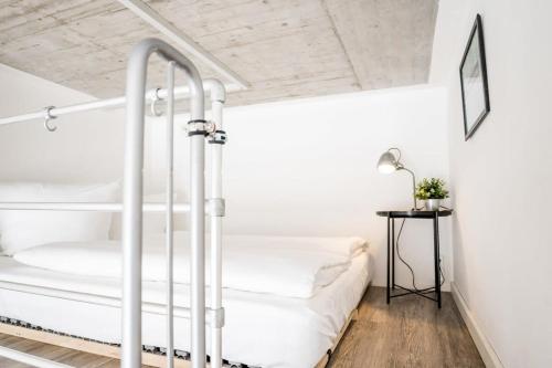 a bedroom with a bunk bed and a table at Industrial Loft in Berlin Mitte in Berlin