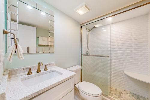 a bathroom with a toilet and a sink and a shower at Sea Colony---902 Annapolis House in Bethany Beach