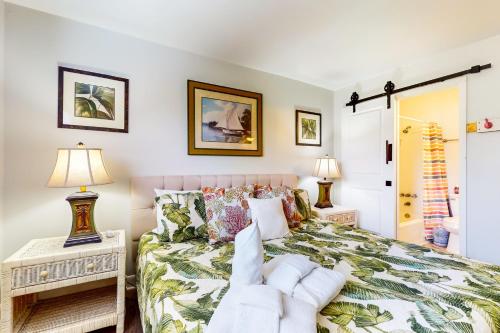 a bedroom with a bed and two tables with lamps at Hilton Head Resort 4336 in Hilton Head Island