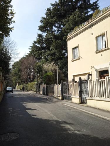 a car parked on a street next to a house at Maison Saragozza in Bologna