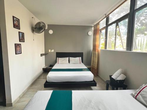 מיטה או מיטות בחדר ב-Hotel Casa Botero Medellín RNT 152104