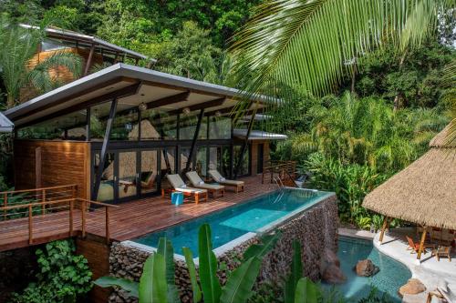 a villa with a swimming pool and a resort at The Resort at Isla Palenque Member of the Cayuga Collection in Boca Chica