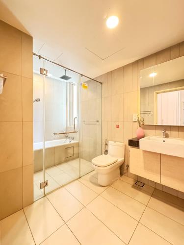 a bathroom with a toilet and a sink and a shower at KidsVille Slide LoftPlay Safari, Afiniti I 5mins Walk to Legoland JB, Johor Bahru, Malaysia in Nusajaya