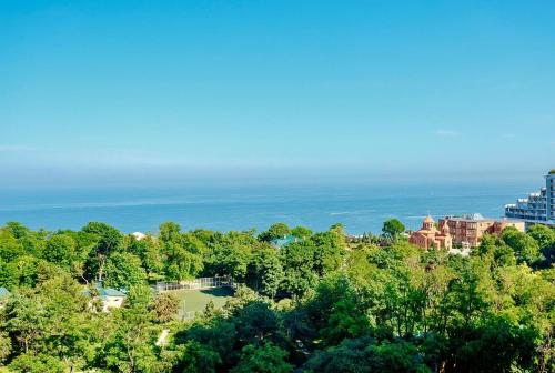 an aerial view of a resort with the ocean in the background at Odesa Pearl Apartments in Odesa