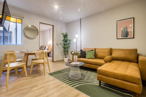 a living room with a couch and a table at VICENTE SUAREZ By Mr W in Mexico City