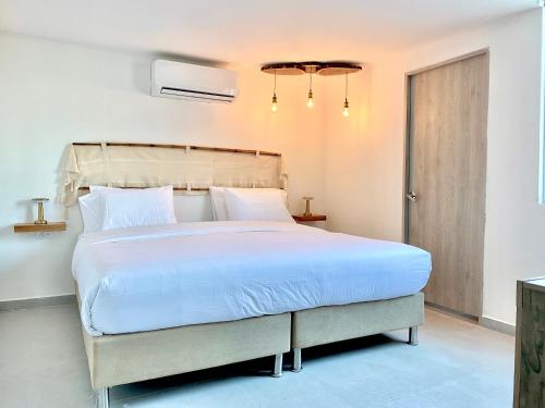 Postel nebo postele na pokoji v ubytování Bocagrande Comfort Stays