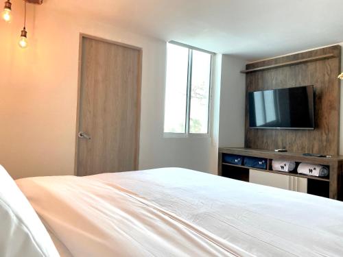 TV a/nebo společenská místnost v ubytování Bocagrande Comfort Stays
