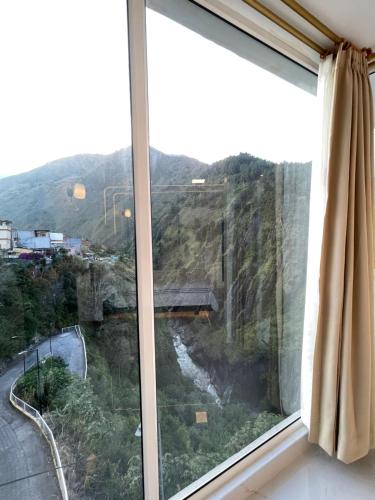 a window with a view of a mountain at Hostal Balcon del Cielo in Baños