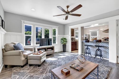 a living room with a couch and a table at East Village Apartments in Long Beach