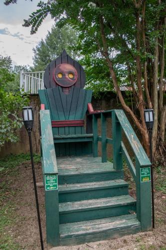 a statue of a train sitting on a set of stairs at Elk River Hotel & Cafe in Sutton