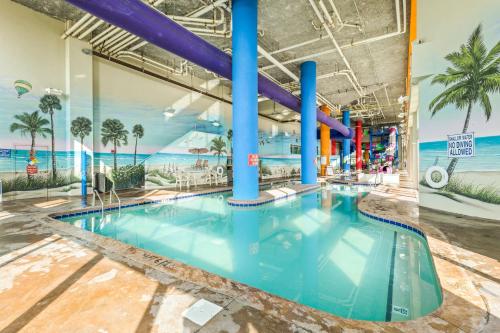 a large pool with a water slide in a building at Dunes Village/King bedOceanfront 2b/2b/waterpark in Myrtle Beach