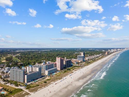 an aerial view of a beach with buildings and the ocean at Dunes Village/King bedOceanfront 2b/2b/waterpark in Myrtle Beach