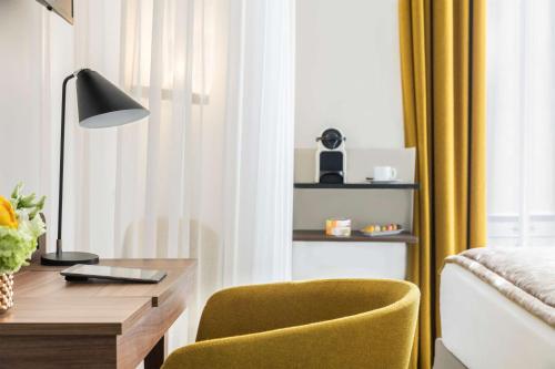 Ein Bett oder Betten in einem Zimmer der Unterkunft Best Western Plus La Demeure
