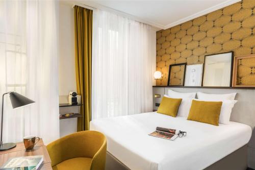 Ein Bett oder Betten in einem Zimmer der Unterkunft Best Western Plus La Demeure
