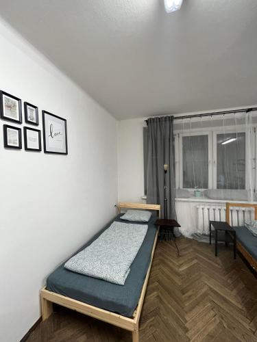 a bedroom with a bed and a window in it at Nice flat in City Center Kraków in Krakow