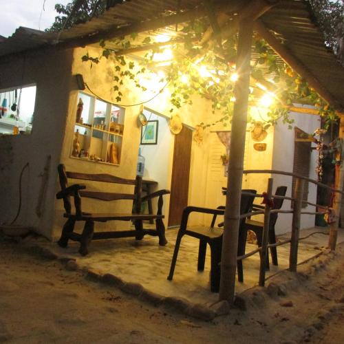 a house with a bench and a table in front of it at Jumanji in Palomino