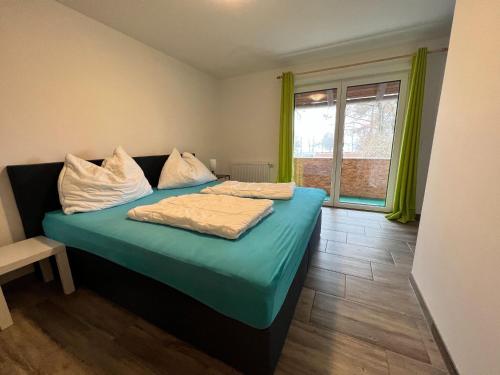 Ένα ή περισσότερα κρεβάτια σε δωμάτιο στο Apartment Bodensdorf near Ski & Lake