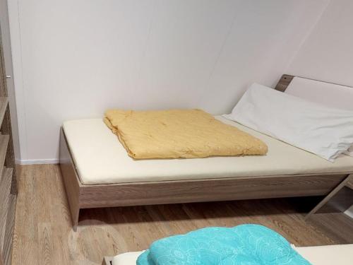 a bed in a room with a mattress on it at Tranquil Mobile Home at Ossiacher See in Tratten