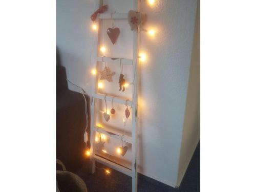 a bunch of lights hanging on a wall at Apartment in Lower Saxony in Halstenbek