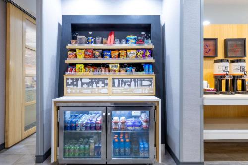 a refrigerator filled with lots of drinks in a store at Hampton Inn Richmond-Mechanicsville in Mechanicsville