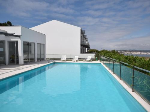 a large swimming pool on top of a building at Holiday Home near São Martinho Beach in Salir de Porto