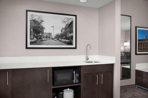 a kitchen with a sink and a microwave at Hampton Inn Easton in Easton