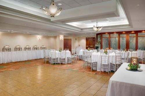 a banquet hall with white tables and chairs at Hampton Inn Easton in Easton