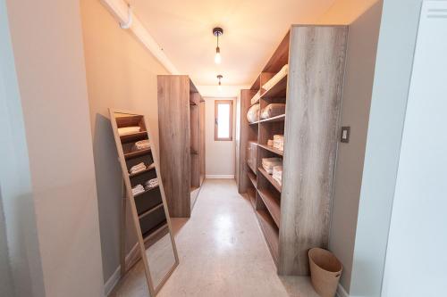 a walk in closet with wooden shelves at Cayalá Lofts in Guatemala
