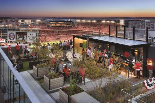 a group of people standing on the roof of a ballpark at Hampton Inn & Suites Washington, D.C. - Navy Yard in Washington, D.C.