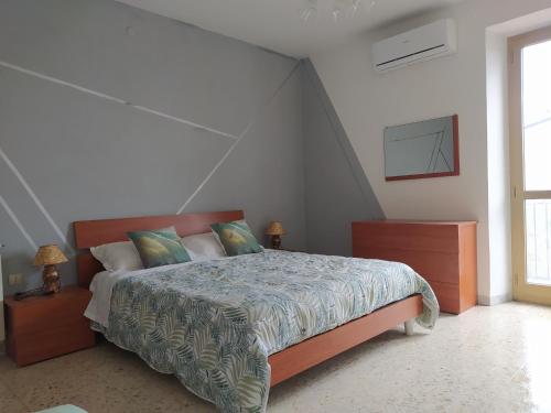 a bedroom with a bed in a attic at Il giardino degli Ulivi house in Ortona