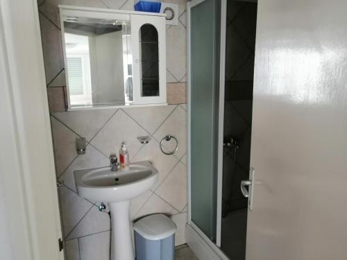 a bathroom with a sink and a mirror at Apartments with a parking space Vinjerac, Zadar - 22585 in Posedarje
