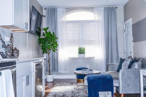a living room with a couch and a table at Beautiful Irving two bedroom apartment in Philadelphia