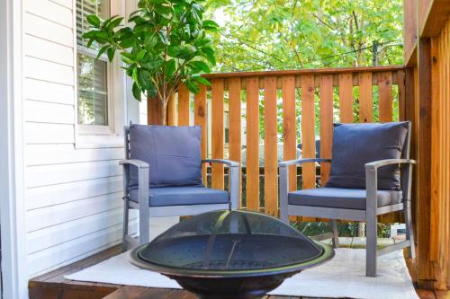 two chairs and a table on a porch at Beautiful Irving two bedroom apartment in Philadelphia