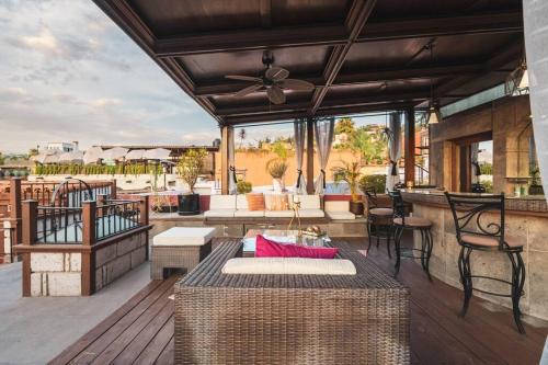 a patio with a table and chairs on a deck at Lovely house at the heart of San Miguel in San Miguel de Allende