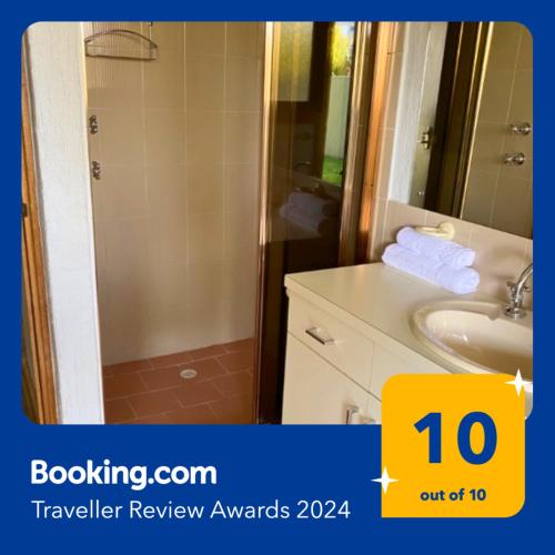 a bathroom with a shower and a sink at Esplanade 3BR Holiday Home with Magic Ocean Views in Encounter Bay