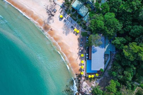 an overhead view of a beach with chairs and the ocean at One Beach Resort in Koh Rong Sanloem