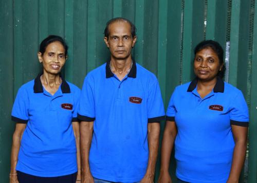 a group of three people wearing blue polo shirts at Oasis Colombo in Colombo