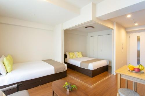 Кровать или кровати в номере Bon condomium Umeda - Vacation STAY 7724