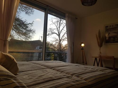 Ένα ή περισσότερα κρεβάτια σε δωμάτιο στο Tigre Studio Apartment
