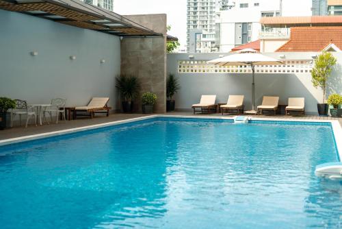 a swimming pool on top of a building at HAMPTONS Apartments in Phnom Penh