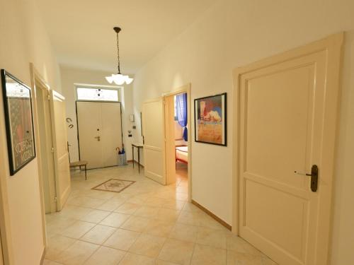 a hallway with a door leading to a living room at Vacation home with private pool, Floridia in Floridia