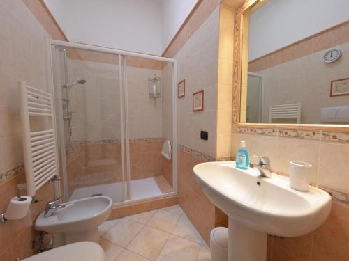 a bathroom with a sink and a shower and a toilet at Vacation home with private pool, Floridia in Floridia