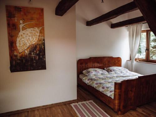 a bedroom with a bed and a picture of an umbrella at Apartment in Gronowo near Lake Siecino in Gronowo