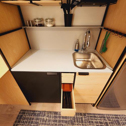 a small kitchen with a sink and a sinkessment at Private Home Studio Central Located in Miami 1 in Opa-locka