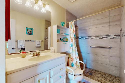 a bathroom with a sink and a shower at Salt, Sand, Sea in North Port