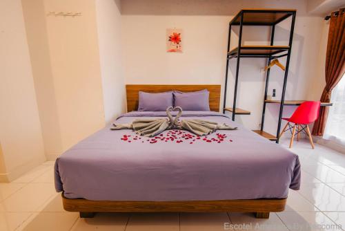 Ένα ή περισσότερα κρεβάτια σε δωμάτιο στο Escotel Amazana By Reccoma