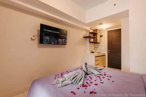 Ένα ή περισσότερα κρεβάτια σε δωμάτιο στο Escotel Amazana By Reccoma