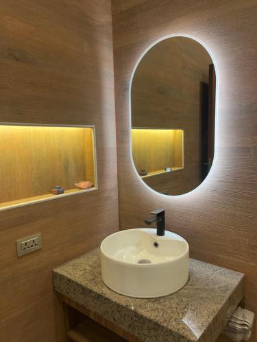 a bathroom with a sink and a mirror at Departamentos Sosucro in Montero