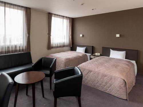 Postel nebo postele na pokoji v ubytování Hotel Epoka Tabist