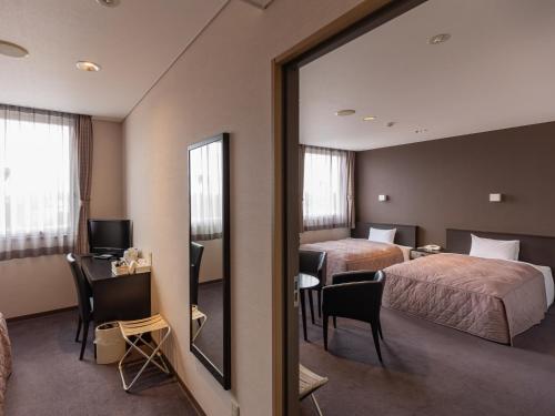 Una cama o camas en una habitación de Hotel Epoka Tabist